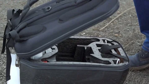 Mens hand taking remote controller out from the case. Stock Footage 69960052