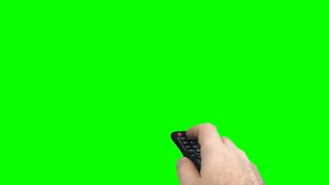 A men's hand uses a remote control on green screen 스톡 동영상 73293195