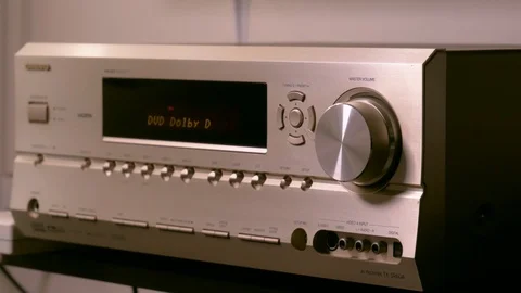 Men's hands are changing the volume in the amplifier of the home theater. Stock Footage 88616840