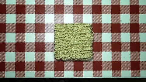 Men's hands breaking open instant noodles Stock Footage 103428645