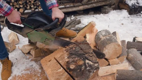 Men's hands with a chainsaw closeup 動画素材 72465626