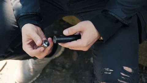 Men's hands collect an electronic cigarette. Stock Footage 74136462