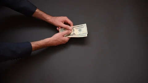 Men's hands count banknotes on the dark background. Stock Footage 125418491