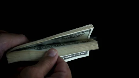 Men's hands count a pack of dollar bills Video stock 130176052