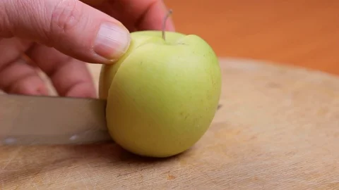 Men's Hands Cut The Green Apple Stock Footage