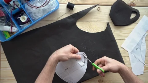 Mens hands cut out pattern mask with scissors. Stock Footage 130023689