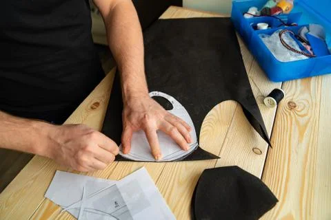 Mens hands cut out pattern mask with scissors. Stock Photos