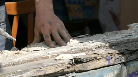 Men's hands dismantle the frames of an old rotten wooden window. Replacing an Stock Footage 128507840