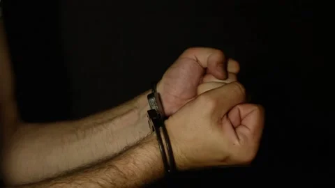 Men's hands in handcuffs Stock Footage 89353584