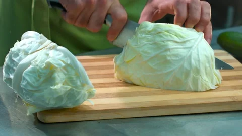 Men's hands with a knife cut cabbage Stock Footage 134469937