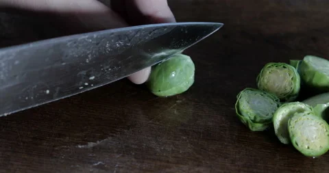 Men's hands with a knife cut cabbage on the cutting board Stock Footage 144828635