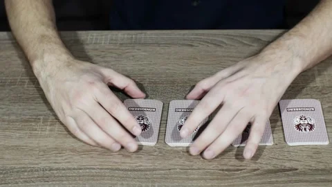 Men's hands lay out playing cards on the table. Gambling.  Stock Footage 299730863