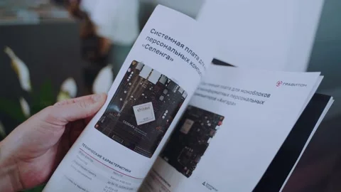 Men's hands leaf through the catalog of computer components Stock Footage 197008676