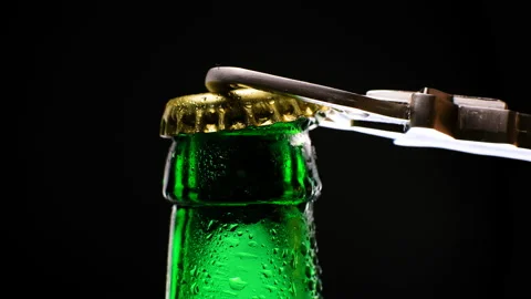 Men's hands open bottle of beer. Stock Footage 153606818