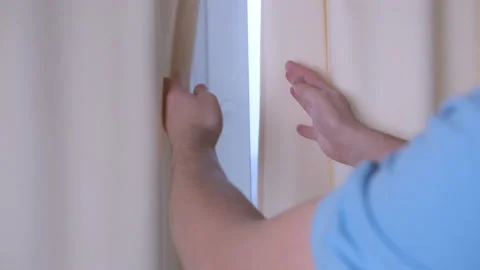 Men's hands open the curtains on the window, close-up Stock Footage 167028203