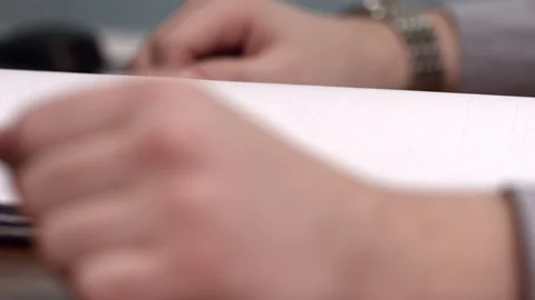 Men's hands open documents Stock Footage 128168727