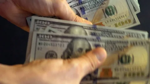 In men's hands a pack of dollars. Stock Footage 114379615