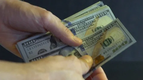 In men's hands a pack of dollars. Stock Footage 114379996