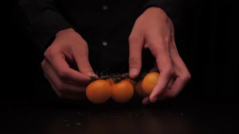 Men's hands put colored red pepper and tomato on the table and show thumbs up on Stock-Footage 144370391