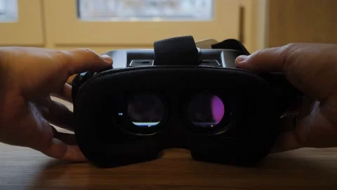 Men's hands put virtual reality glasses on the table. Video stock 143838014