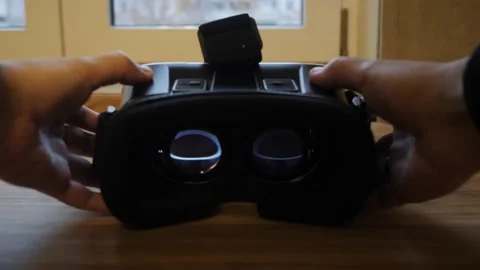 Men's hands put virtual reality glasses on the table. Video stock 143927279