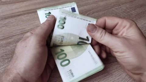 Men's hands quickly counting 100 euro bills Video stock 259557404