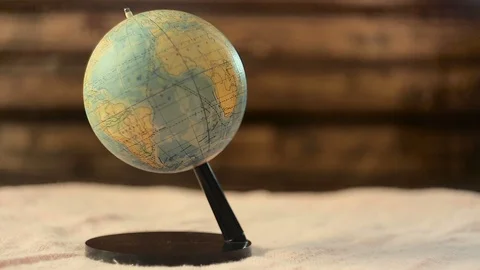 Men's hands rotate the globe Stock Footage 89029146
