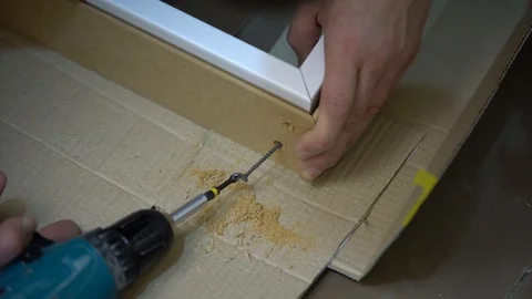 Men's hands screw the screw  Stock Footage 104028047