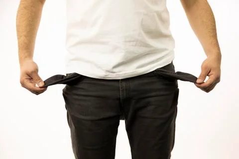 Men's hands show empty inside-out pants pockets Stock Photos