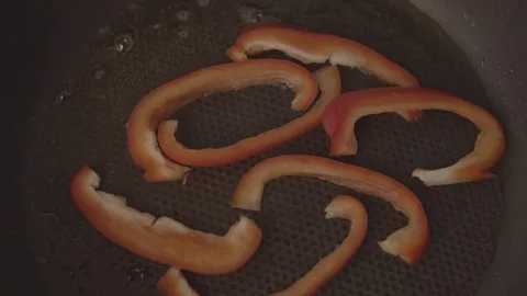 Men's hands spread paprika in the pan for frying Stock Footage