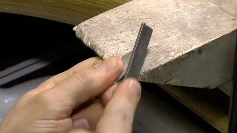 Men's hands treated silver workpiece Stock Footage 103560566