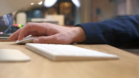 Men's hands type on a white keyboard, then scroll and click the mouse, close-up Stock Footage 232096780