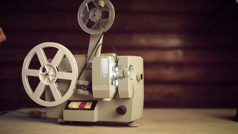 Men's hands will take the old film projector Stock Footage 89566341