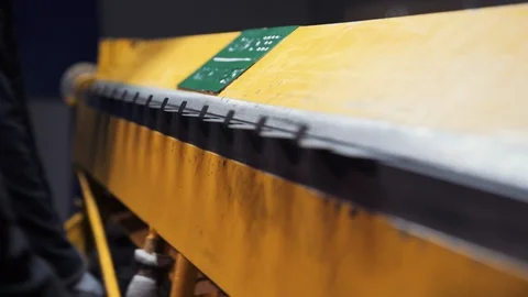 Men's hands work on a manual machine that bends sheets of metal Stock Footage 108648674