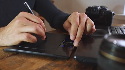Men's hands working on a graphics tablet Video stock 128630796