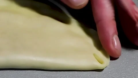Men's Hands Wrap the Edges of a Cheburek or Dumpling. Dough for Pizza, Bread. Stock Footage 231752697