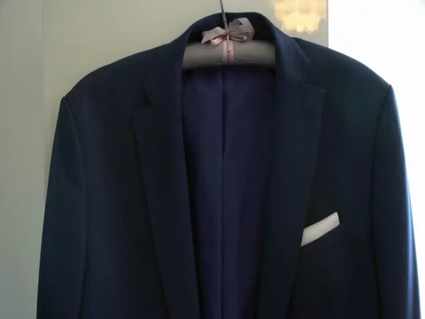 Men's jacket hanging on a hanger 스톡 동영상 78611461