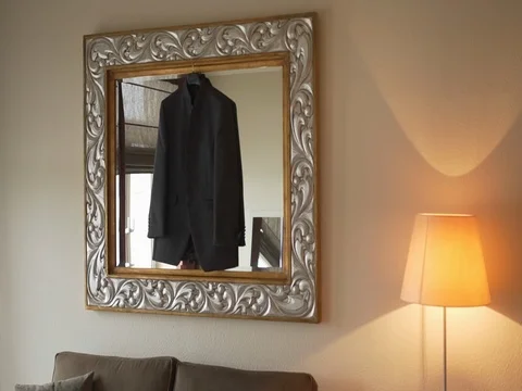 The men's jacket weighs in the mirror Stock Footage 81539913