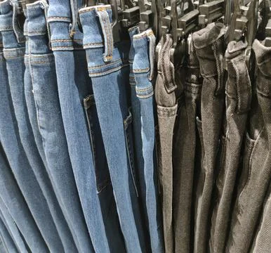 Men's jeans of different models Stock Photos