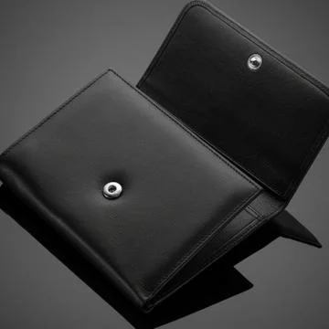 Men's wallet on a black background Stock Photos