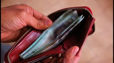 Men's wallet counting Peruvian 100 soles bills. Stock Footage 283854830
