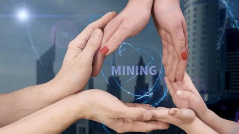 Men's, women's and children's hands show a hologram Mining Stock Footage 93046653