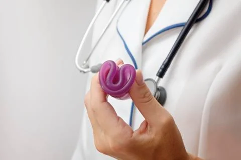 Menstrual Cup in doctor's hand, close-up, concept of women's health and ecology Stock Photos