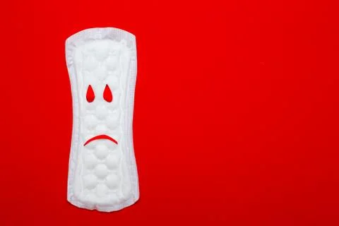 Menstruation concept. a menstrual pad on red background Stock Photos