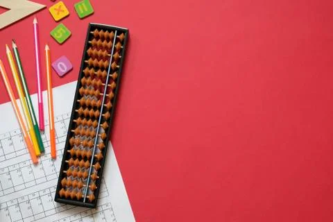 Mental arithmetic and math concept: colorful pens and pencils, numbers, abacus Stock Photos
