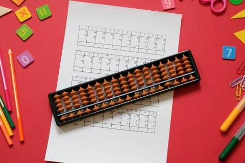 Mental arithmetic and math concept: colorful pens and pencils, numbers, abacus Stock Photos
