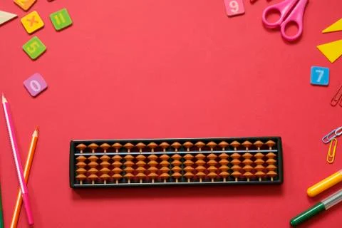 Mental arithmetic and math concept: colorful pens and pencils, numbers, abacus Stock Photos