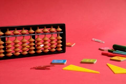 Mental arithmetic and math concept: colorful pens and pencils, numbers, abacus 스톡 사진