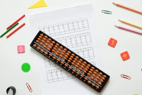 Mental arithmetic and math concept: colorful pens and pencils, numbers, abacus Stock Photos