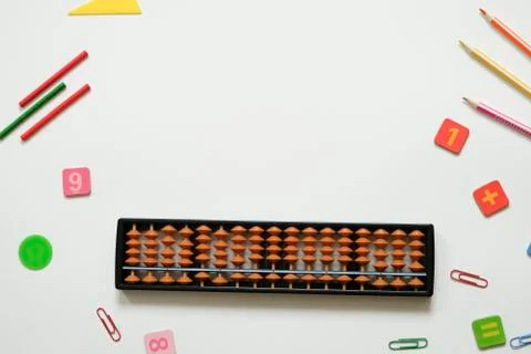Mental arithmetic and math concept: colorful pens and pencils, numbers, abacus Stock Photos